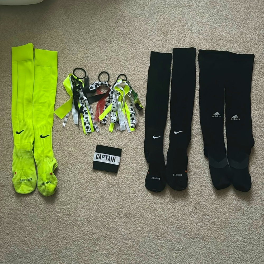 Black and neon yellow soccer socks with ribbons and captain band
